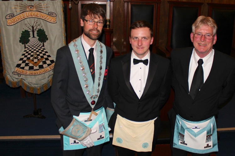 The Master of Gartree Lodge (left) along with the Master of The Wyggeston Lodge (right) and Bro. Maxfield (middle)
